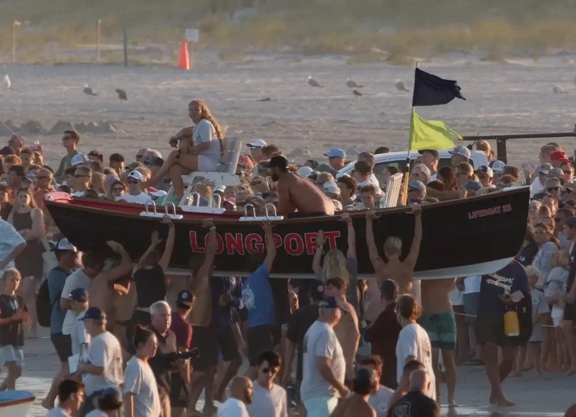 Celebrating singles row victory on beach
