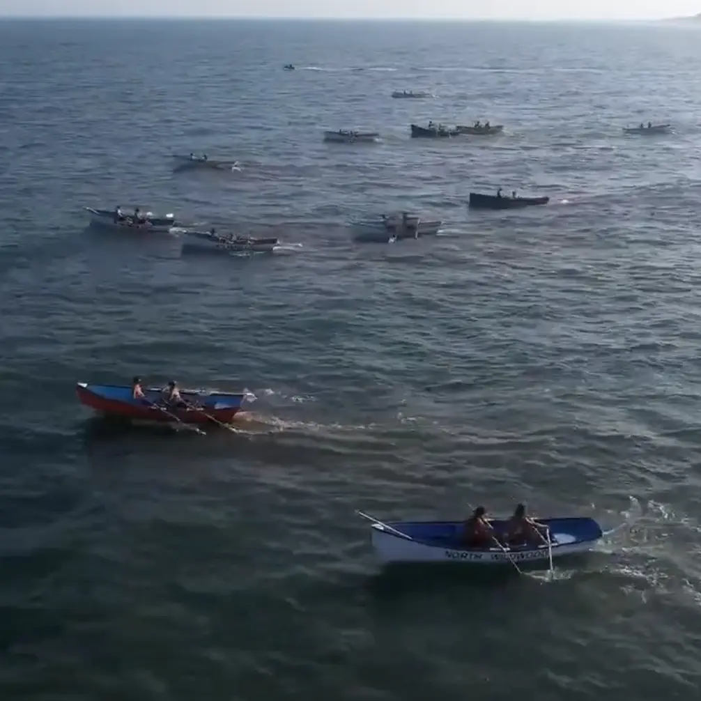 Boats in ocean rowing