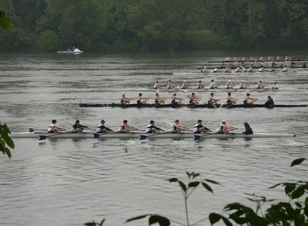 Boats racing on Schuylkill river in Stotesbury Cup Regatta